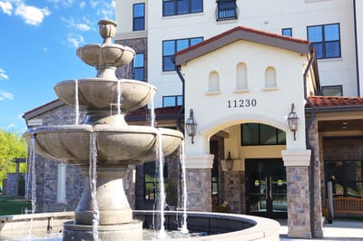 Exterior view of the facility entrance with fountain