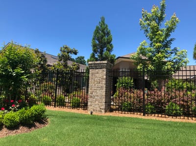 Exterior view of a senior living facility surrounded by greenery