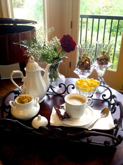 Table setting with coffee and dessert items
