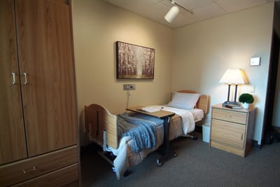 Cozy resident room with a bed and furniture