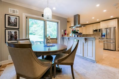 Bright kitchen with a dining table and window view