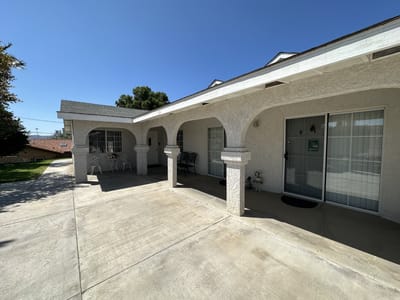Exterior view of the facility with patio seating