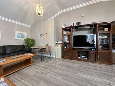 Common area with seating and entertainment center