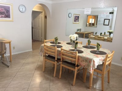Dining area with a decorated table and chairs