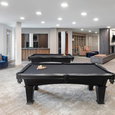 Interior view of a game room with a billiards table