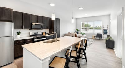 Modern kitchen and living area in a senior living unit