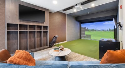Interior of a recreational space with golf simulator