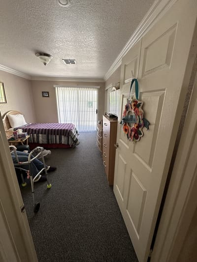 Resident room with furniture and personal items