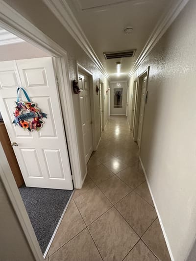 An interior hallway with rooms and decor