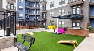 Outdoor recreation area with benches and lawn