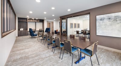 Interior view of a meeting room with table and chairs
