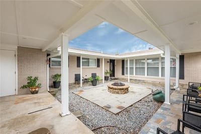 Outdoor seating area with fire pit and landscaping
