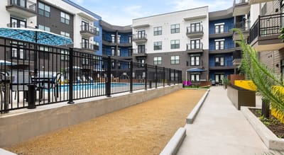 Outdoor space with a pathway and swimming pool