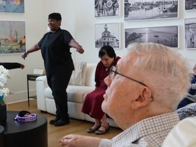 Residents participating in an activity with a staff member