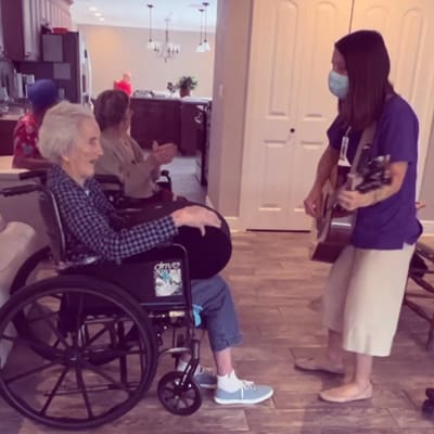 Residents enjoying a music activity in the common area