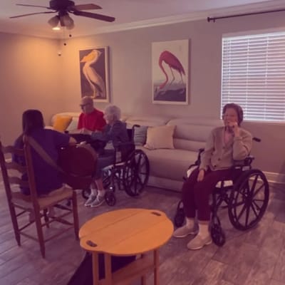 Residents enjoying music in a cozy common area