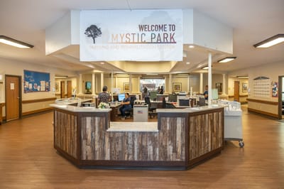 Reception area with welcoming sign and staff members