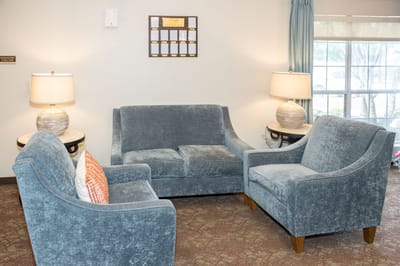Cozy common area with seating and lamps