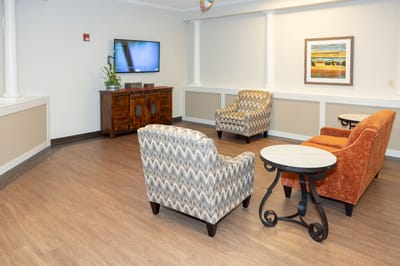 Cozy common area with seating and a TV