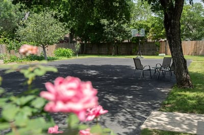 Outdoor space with chairs and basketball hoop