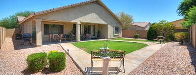 Outdoor area with a shaded patio and seating
