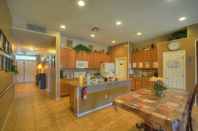 Bright common area with kitchen and dining table