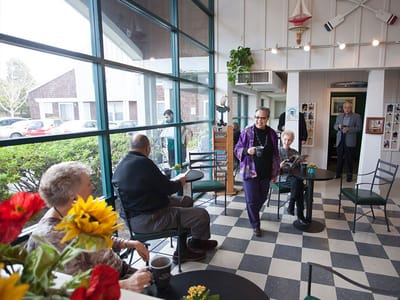 Residents socializing in a cozy common area