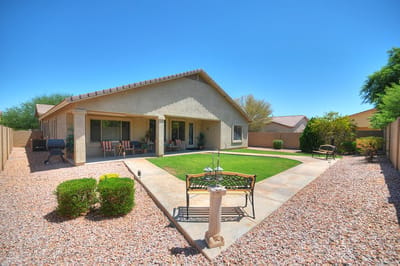 Exterior view of a home with a landscaped yard