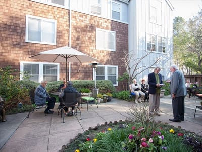 Residents enjoying a gathering in the garden area
