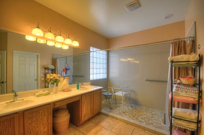 Bright bathroom with accessible shower and storage