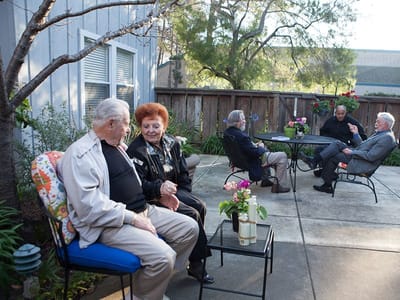 Residents enjoying conversation in an outdoor space