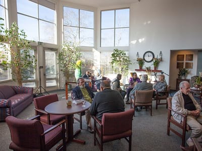Residents engaging in conversation in a common area