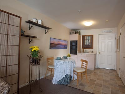 Cozy resident kitchen area with dining table