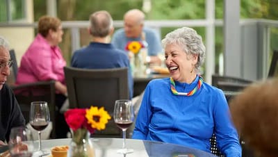 Residents enjoying a social gathering with drinks