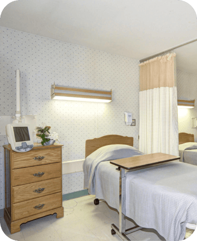 A well-furnished private resident room in a nursing home
