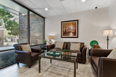 Cozy lounge area with comfortable seating and natural light