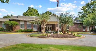 Exterior view of Mt Vernon Village facility with landscaping