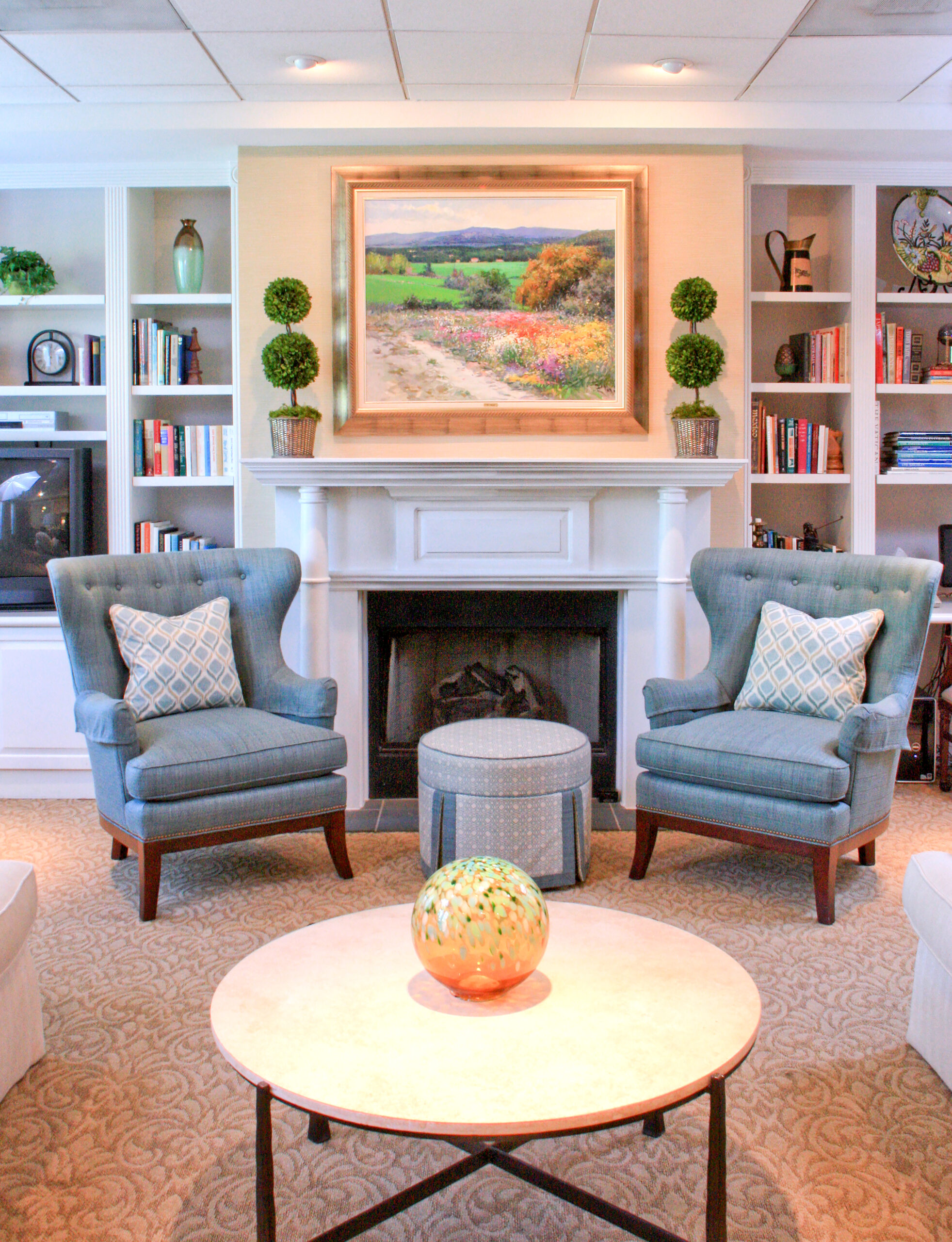 Cozy common area with comfortable seating and artwork