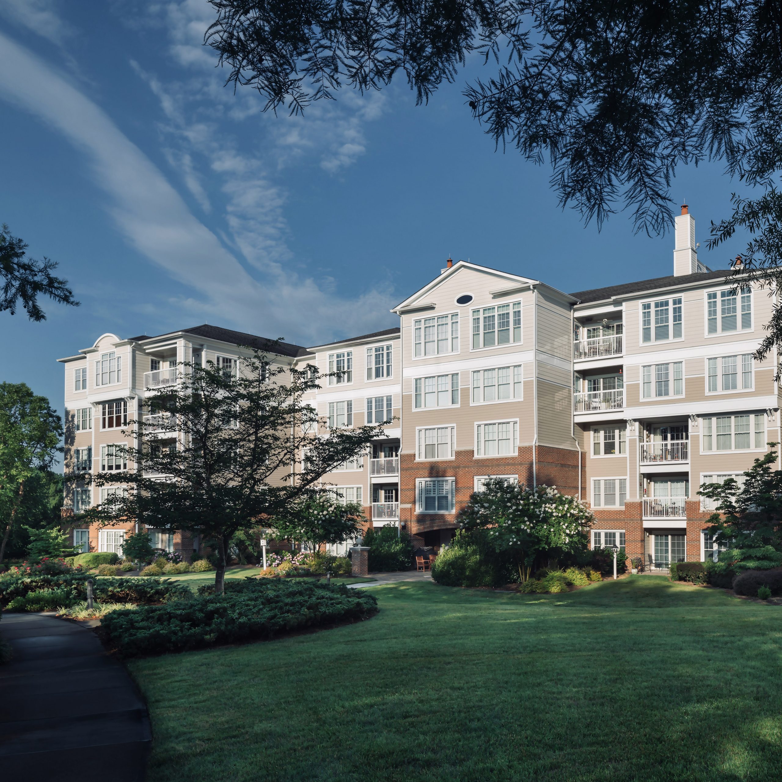 Exterior view of The Cypress of Charlotte building and gardens