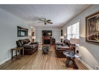 Cozy common area with leather sofas and decorative artwork