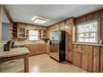 Bright kitchen area with wooden cabinetry