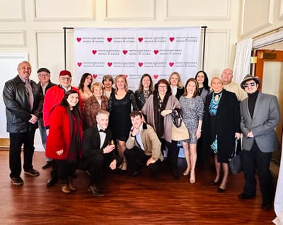 Group photo of staff and residents at a celebration