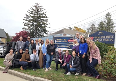 Group of staff members outside the facility