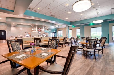 Bright dining area with tables and chairs