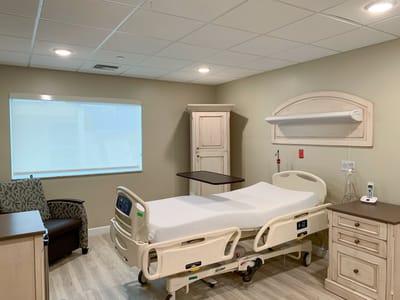 Private resident room with a hospital bed