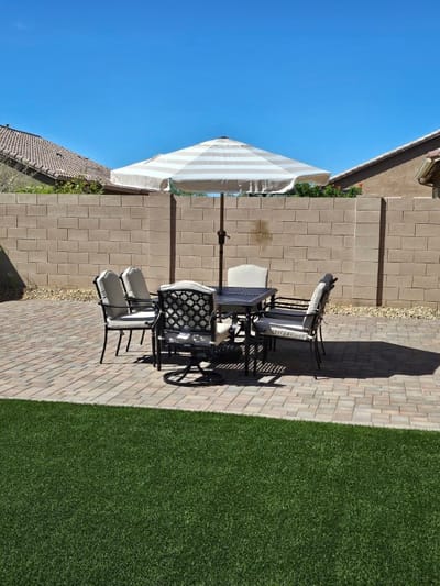 Outdoor seating area with patio table and umbrella