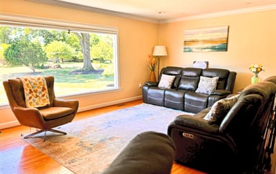 Bright common area with seating and a view of the outdoors