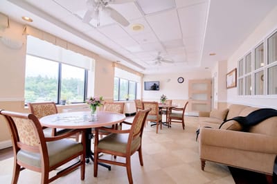 Bright common area with seating and tables