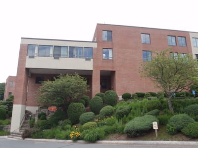 Exterior view of a senior living facility with landscaping