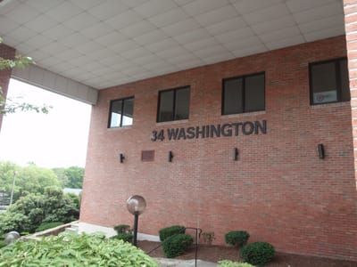 Exterior view of the facility with signage